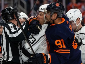 Edmonton Oilers' Evander Kane (91) battles L.A. Kings' Dustin Brown (23) during first period of NHL playoff action at Rogers Place in Edmonton, on Monday, May 2, 2022. Photo by Ian Kucerak