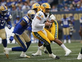 Edmonton Elks quarterback Nick Arbuckle (9) looks downfield against the Winnipeg Blue Bombers on the way to a 30-20 win in Winnipeg on Friday, May 27, 2022.