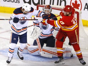 Calgary Flames forward Matthew Tkachuk battles Edmonton Oilers goalie Mikko Koskinen during Round 2 of the Western Conference finals at the Scotiabank Saddledome in Calgary on Wednesday, May 18, 2022.