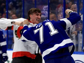 Alex Formenton #10 of the Ottawa Senators and Anthony Cirelli #71 of the Tampa Bay Lightning fight in the third period during a game at Amalie Arena on March 01, 2022 in Tampa, Florida. (Photo by Mike Ehrmann/Getty Images)