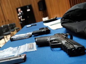 Guns confiscated at New York City public schools are displayed at a news conference with Mayor Eric Adams at police headquarters to speak about guns in public schools in New York City, Wednesday, May 25, 2022.