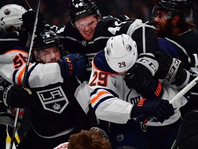 Los Angeles Kings defenseman Mikey Anderson (44) grabs Edmonton Oilers center Leon Draisaitl (29) as right wing Kailer Yamamoto (56) grabs defenseman Matt Roy (3) during the first period in game six of the first round of the 2022 Stanley Cup Playoffs at Crypto.com Arena.