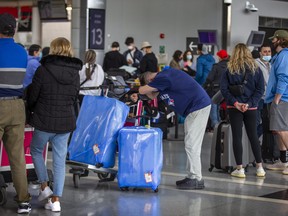 Mustapha Badia (resting head) arrived almost seven hours before his flight to Lisbon out of Terminal 1 at Toronto Pearson International Airport on Tuesday, May 3, 2022.