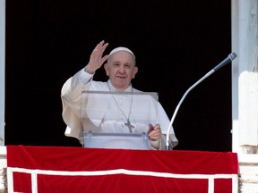 Pope Francis leads the Angelus prayer from a window of the Apostolic Palace at Saint Peter's Square, at the Vatican, March 6, 2022. Vatican Media/­Handout via REUTERS