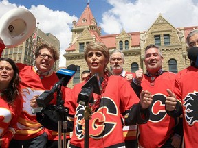 Mayor Jyoti Gondek speaks to cheers for the Flames with council members following a performance from the Calgary Stampede Showband brass choir outside City Hall to get in the mood for Game 4 against the Flames and Oilers on Tuesday, May 24, 2022.