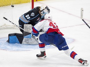Edmonton Oil Kings forward Justin Sourdif scores the game-winning goal on Winnipeg Ice goaltender Gage Alexander in overtime period of their Western Hockey League playoff series Monday, May 23, 2022, in Edmonton.