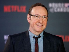 In this file photo taken on Feb. 26, 2015, actor Kevin Spacey poses for photographers on the red carpet ahead of the world premiere of the television series 'House of Cards - Season 3 Episode 1' in London.