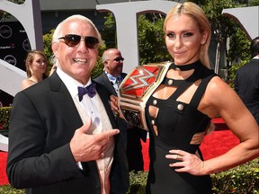 WWE wrestler Ric Flair and daughter WWE Diva Charlotte attend the 2016 ESPYS at Microsoft Theater on July 13, 2016 in Los Angeles.