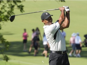 May 16, 2022; Tulsa, Oklahoma, USA; Tiger Woods hits his tee shot on the 13th hole during a practice round for the PGA Championship golf tournament at Southern Hills Country Club.