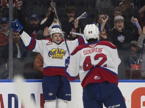 The Edmonton Oil Kings' Kaiden Guhl (4) and Justin Sourdif (42) celebrate the Oil Kings' four goal against the Winnipeg Ice during first period action at Rogers Place, in Edmonton Friday May 27, 2022.
