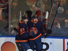 Edmonton Oilers Zach Hyman (18) celebrates his goal with Ryan Nugent-Hopkins (93) against the Calgary Flames during NHL playoff action at Rogers Place in Edmonton, May 24, 2022.