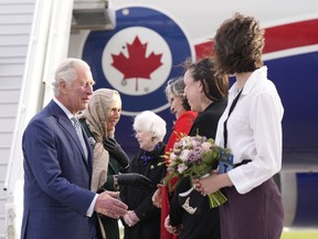 Prince Charles and Camilla, Duchess of Cornwall are greeted as they arrive in Ottawa as part of a three-day Canadian tour, Tuesday, May 17, 2022.