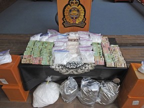 Edmonton Police have charged four Edmonton men and seized more than $1.3 million in drugs and cash following a 14-month organized crime investigation. Photos from EPS 2022