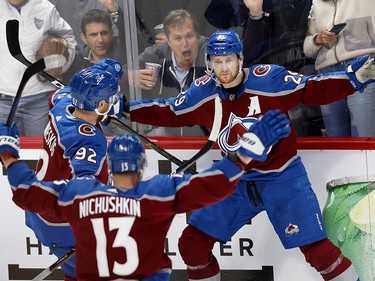 Nathan MacKinnon #29 of the Colorado Avalanche celebrates with teammates Gabriel Landeskog #92 and Valeri Nichushkin #13 after scoring a goal against the Edmonton Oilers during the first period in Game One of the Western Conference Final of the 2022 Stanley Cup Playoffs at Ball Arena on May 31, 2022 in Denver, Colorado.