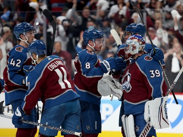 Pavel Francouz #39 of the Colorado Avalanche celebrates with Cale Makar #8, Andrew Cogliano #11, Josh Manson #42 and Erik Johnson #6 after defeating the Edmonton Oilers with a score of 8 to 6 in Game One of the Western Conference Final of the 2022 Stanley Cup Playoffs at Ball Arena on May 31, 2022 in Denver, Colorado.