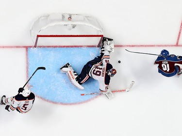 Mikko Koskinen #19 of the Edmonton Oilers makes a save against Nazem Kadri #91 of the Colorado Avalanche in Game One of the Western Conference Final of the 2022 Stanley Cup Playoffs at Ball Arena on May 31, 2022 in Denver, Colorado.