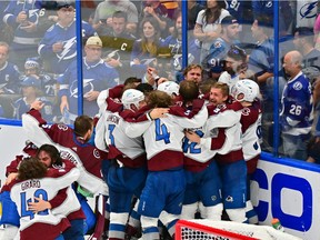 Colorado Avalanche players celebrate after defeating the Tampa Bay Lightning 2-1 in Game Six of the 2022 NHL Stanley Cup Final at Amalie Arena on June 26, 2022 in Tampa, Florida.