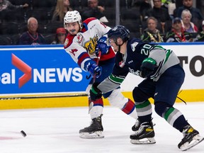 Edmonton Oil Kings' Josh Williams (14) fires a shot past Seattle Thunderbirds' Samuel Knazko (20) during second period WHL Championships action at Rogers Place in Edmonton, on Friday, June 3, 2022.