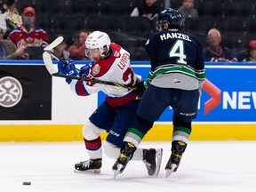 Edmonton Oil Kings' Jalen Luypen (23) battles Seattle Thunderbirds' Jeremy Hanzel (4) during second period WHL Championships action at Rogers Place in Edmonton, on Friday, June 3, 2022.