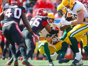 The Calgary Stampeders' Jameer Thurman received a roughing the passer call against quarterback Trevor Harris of the Edmonton Elks at McMahon Stadium on Monday, Sept. 6, 2021.