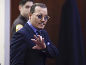 Johnny Depp reacts as he leaves for a recess at the Fairfax County Circuit Court in Fairfax, Va., Thursday, May 5, 2022.