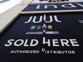 In this file photo taken on Sept. 17, 2019 a sign advertises Juul vaping products in Los Angeles, Calif.