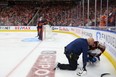 Colorado Avalanche forward Nazem Kadri is tended to after being shoved into the boards by Evander Kane of the Edmonton Oilers during Game 3 of the Western Conference Final. Kadri has a broken thumb and missed Game 4 on Monday night .