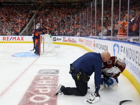 Colorado Avalanche forward Nazem Kadri is tended to after being shoved into the boards by Evander Kane of the Edmonton Oilers during Game 3 of the Western Conference Final. Kadri has a broken thumb and missed Game 4 on Monday night .