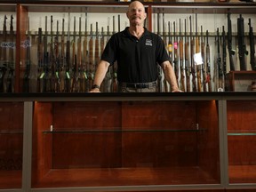 Calgary Shooting Centre owner James Bachynsky was photographed with empty cases that would normally be displaying handguns on Friday, June 3, 2022.