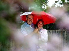 Don Goss and his wife Laurie Goss pose for a photo, in their Edmonton backyard Wednesday June 22, 2022. Goss says he was preparing himself for hospice care, when he was offered a spot in a clinical trial for cancer patients where chemo and radiation has stopped working. He credits the therapy for saving his life. Photo By David Bloom