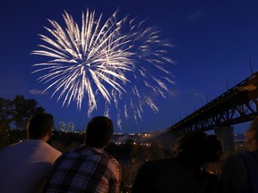 Fireworks explode above the North Saskatchewan River near the High Level Bridge for Canada Day in Edmonton, Alta., on Monday, July 1, 2013.