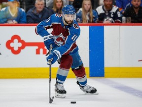 Colorado Avalanche center Andrew Cogliano (11) controls the puck in the first period against the Edmonton Oilers in game two of the Western Conference Final of the 2022 Stanley Cup Playoffs at Ball Arena.