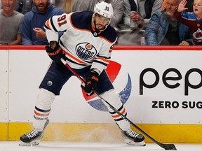 Edmonton Oilers left wing Evander Kane (91) controls the puck in the first period against the Colorado Avalanche in game two of the Western Conference Final of the 2022 Stanley Cup Playoffs at Ball Arena.