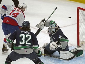 Edmonton Oil Kings Josh Williams evades a check from Seattle Thunderbirds Matthew Rempe and scores on Seattle goalie Thomas Milic during first period game action during game five of the Western Hockey League Championship series final in Edmonton on Saturday, June 11, 2022.