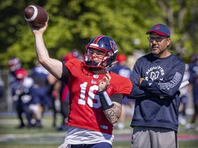 Quarterbacks coach Anthony Calvillo watches Ben Holmes throw a pass during Montreal Alouettes training camp practice in Trois-Rivieres,  Que., on May 25, 2022.