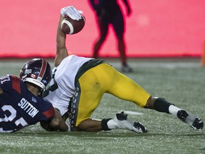 Edmonton Elks receiver Kenny Lawler (89) raises the ball in the air after scoring the winning touchdown on Montreal Alouettes defensive back Wesley Sutton (37) in Montreal on July 14, 2022.