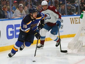 Robert Thomas of the St. Louis Blues controls the puck as Erik Johnson of the Colorado Avalanche looks on in the first period at Enterprise Center on May 27, 2022 in St Louis, Missouri.