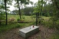 A symbolic grave in the Bialucki Forest near Ilowo on July 13, 2022 the site where the mass grave of about 8,000 Geman Nazi victims from the nearby Soldau concentration camp in Dzialdowo was unearthed at the beginning of July 2022.