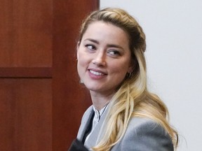 Amber Heard leaves during a break in the courtroom at the Fairfax County Circuit Courthouse in Fairfax, Va., Friday, May 27, 2022.