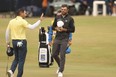 Canadian Corey Conners (right) and Spain's Sergio Garcia finish up their final rounds at the British Open on Sunday.