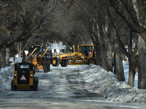 Residential blading is nearly coming to an end as these graders work to plow the snow/ice in the Cloverdale are in Edmonton, February 1, 2022.
