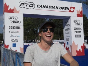 Paula Findlay jokes with a friend at the finish line of the PTO Canadian Open, following a news conference in Edmonton on July 22, 2022.