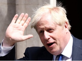 British Prime Minister Boris Johnson walks at Downing Street in London, Britain July 6, 2022.