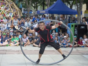 Daniel Craig from The Street Circus performs in a Cyr Wheel for a big crowd. After 10 days and 175,000 guests, the Churchill Square in downtown Edmonton the StreetFest and The Works Festivals have concluded for 2022 on July 17, 2022.
