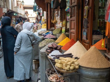 Streets lined with bags of colourful spices in the medina in Marrakech.