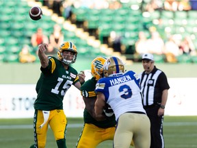 Edmonton Elks' quarterback Taylor Cornelius (15) throws the ball against the Winnipeg Blue Bombers during first half CFL football action at Commonwealth Stadium in Edmonton on Friday, July 22, 2022.