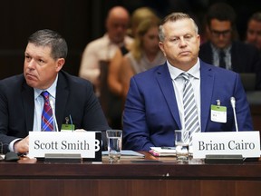 Witnesses Scott Smith, Hockey Canada president and chief operating officer, left, and Hockey Canada chief financial officer Brian Cairo appear at the standing committee on Canadian Heritage in Ottawa on Wednesday, July 27, 2022.