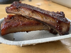 The dry rubbed St. Louis ribs from Smokehouse BBQ (four tickets), reviewed on July 21, 2022, at the Taste of Edmonton festival are cooked to perfection, have great texture and are neat, but no one would complain if they made more of a mess.