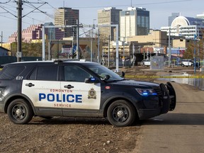 Police tape surrounds an area near the LRT crossing on 95 Street near 105 Avenue on Friday,March 25, 2022 in Edmonton. Greg Southam-Postmedia
