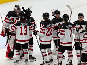 Team Canada celebrates a 5-2 win over Team Latvia during World Junior Hockey Championship action at Rogers Place in Edmonton on Wednesday, Aug. 10, 2022.